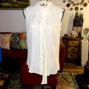 Pretty sleeveless White Anne Klein Button up blouse with tie. Great under suits